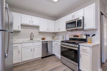 Kitchens with custom cabinetry and gleaming quartz countertops*